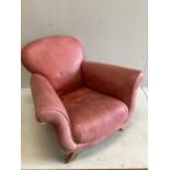 A Contemporary red leather scroll armchair, width 104cm, depth 94cm, height 80cm