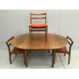 A mid century Meredew circular teak extending dining table, diameter 116cm, height 71cm and three