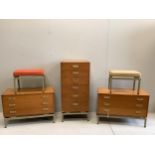 A mid century G Plan Limba teak five piece bedroom suite comprising tall chest, a pair of low chests