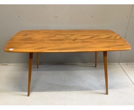 An Ercol rectangular elm dining table, width 150cm, depth 75cm, height 71cm together with six Ercol comb back dining chairs