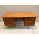 A mid century teak kneehole desk, width 160cm, depth 76cm, height 76cm