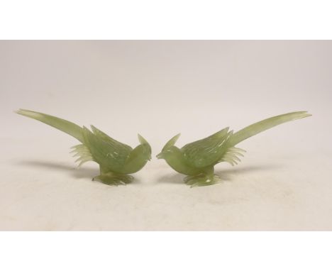 A pair of carved bowenite jade birds on stands, boxed