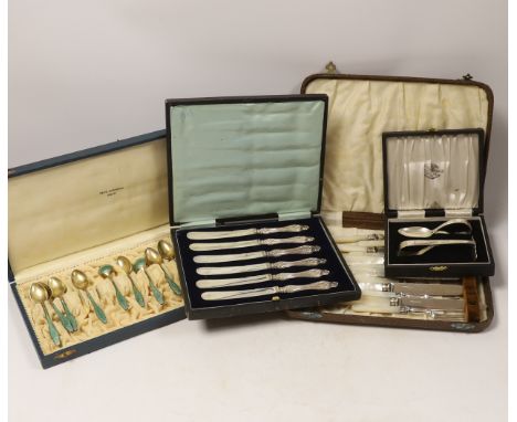 Four assorted cased cutlery sets including a set of twelve Norwegian gilt 925 and guilloche enamel coffee spoons.