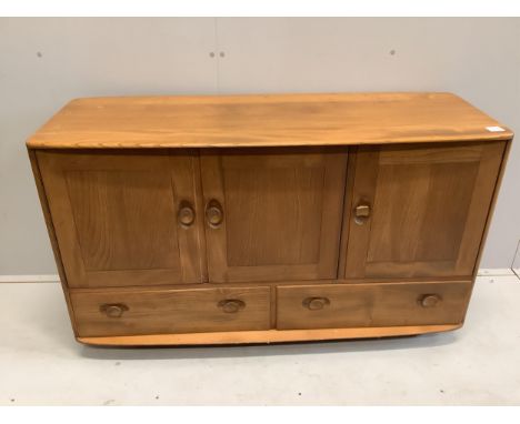 An Ercol Windsor elm sideboard, width 130cm, depth 47cm, height 76cm