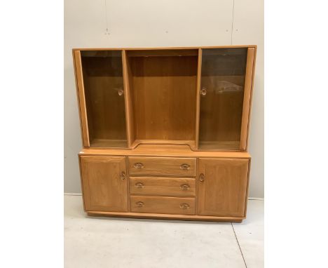 An Ercol Windsor elm sideboard, width 155cm, depth 44cm, height 159cm