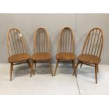 A set of four Ercol elm and beech comb back dining chairs, width 42cm, depth 41cm, height 96cm