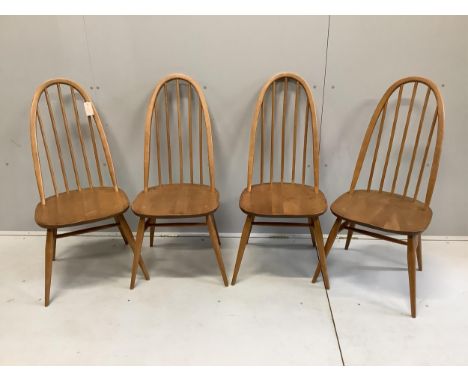 A set of four Ercol elm and beech comb back dining chairs, width 42cm, depth 41cm, height 96cm