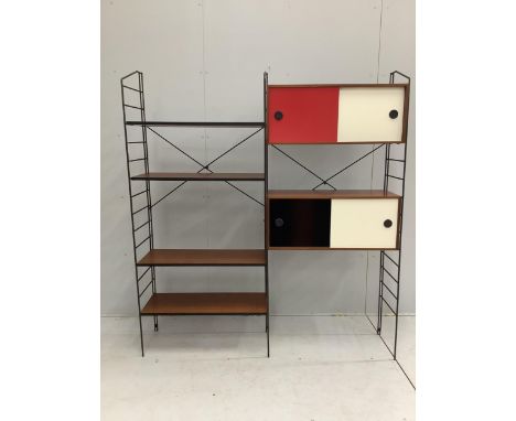 A late 1950's ladder wall unit There are three ladders. Two cabinets and 4 shelves therefore maximum width would be approx. 1