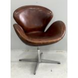 A tan leather petal chair, width 70cm, depth 42cm, height 84cm