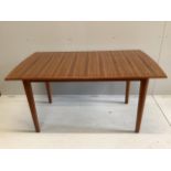 A mid century Gordon Russell teak dining suite comprising rectangular extending table, twelve chairs