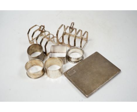 Sundry small silver including a cigarette case, cased set of six sterling and enamel cocktail sticks, two silver toast racks,