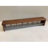 A mid century mahogany and wirework locker room shoe unit, width 147cm, depth 25cm, height 27cm
