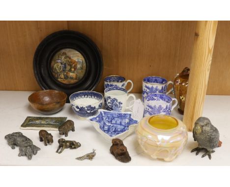 An early 20th century Viennese cold painted bronze figure of an African grey parrot, two 18th century English coffee cups, a 