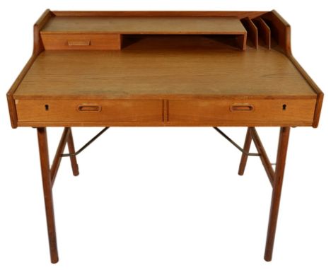 A Danish Teak Writing Desk:Mid-Twentieth century designed by Arne Wahl Iverson for Vinde Mobelfabrik, the raised shelf with a