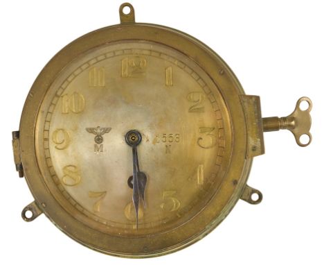 A World War II German U-Boat/Kriegsmarine Clock,  No 1553N:Dial with German Eagle above an M, and numbered 1553N, stamped to 