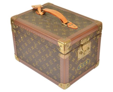 A Louis Vuitton Vanity Case:In LV Monogrammed livery to the outside, opens to reveal a fitted removable mirrored box sitting 