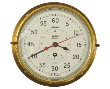 A WWII Smiths Astral Military Warship Bulkhead Clock:A brass ship's bulkhead clock: a hinged brass  bezel with bevelled glass