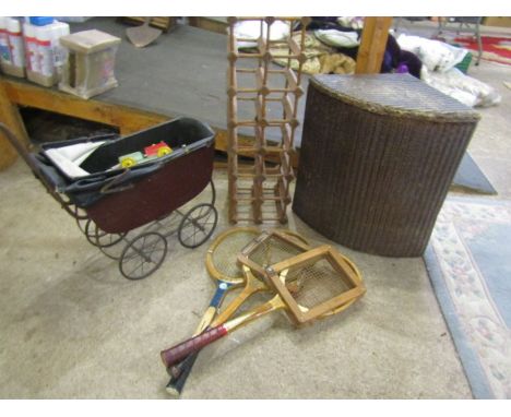 A display vintage pram, vintage rackets, wine rack etc