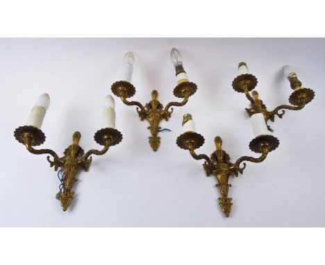 WALL LIGHTS, a set of four, gilt metal, each with twin lighting arms, approx 24cm H x 26cm W, together with a pair with oval 