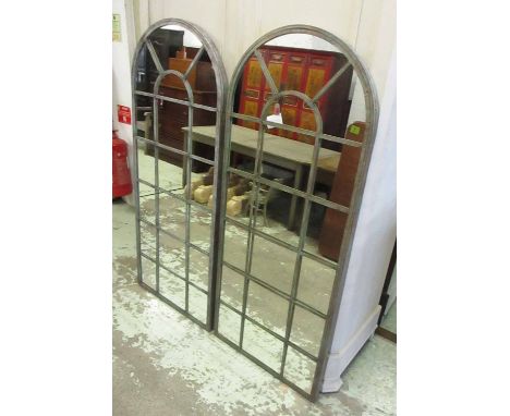 ARCHITECTURAL STYLE GARDEN MIRRORS, a set of three, each metal framed with an arched top, 66cm W x 159cm H. (3)
