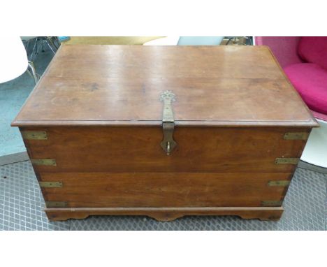 TRUNK, antique Indian teak with brass mounts, hinged top and fitted interior, on bracket supports, 107cm x 66cm x 55cm H. 