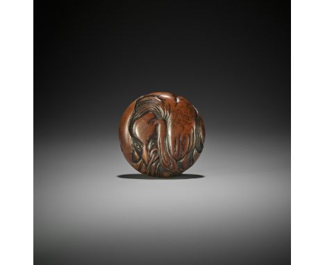 A LARGE MOTHER OF PEARL-INLAID WOOD MANJU NETSUKE DEPICTING AN ELEPHANT AND KARAKOJapan, Edo (Tokyo), mid-19th century, Edo p