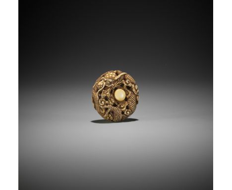 AN IVORY RYUSA MANJU NETSUKE OF A DRAGON WITHIN CLOUDSJapan, Meiji period (1868-1912)The openworked manju finely carved as a 