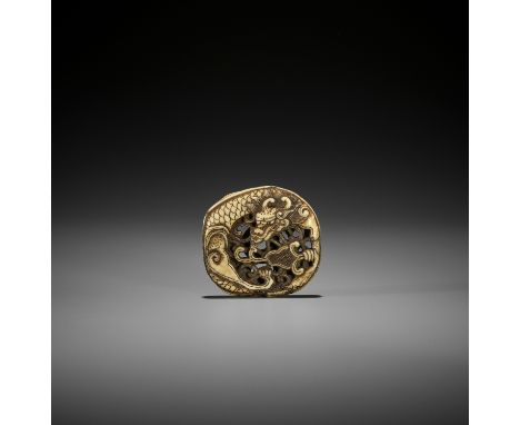 A WALRUS IVORY RYUSA MANJU NETSUKE OF A COILED DRAGONJapan, Tokyo, Asakusa, second half of 19th centuryFinely carved to one s