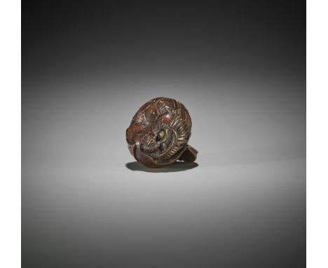 TOYOMASA: A FINE WOOD NETSUKE OF A DRAGON INSIDE MIKANSchool of Naito Toyomasa (1773-1856), signed ToyomasaJapan, Sasayama, T