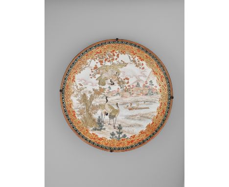 A LARGE ENAMELED KUTANI PORCELAIN CHARGER WITH FALCON AND CRANESSigned Kutani seiJapan, Meiji period (1868-1912)The interior 