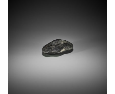 TOKO: AN IWAMI SCHOOL EBONY WOOD NETSUKE OF A MINOGAME ON DRIFTWOODBy Toko, signed Toko and inscribed 元才Japan, Iwami province