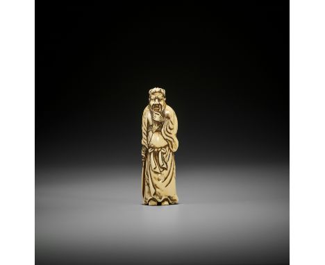 AN EARLY IVORY NETSUKE OF KAN’UJapan, 18th century, Edo period (1615-1868)Finely carved standing in a typically dignified att