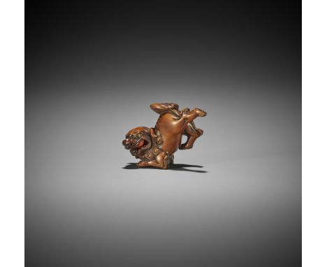 A RARE WOOD NETSUKE OF A RUNNING SHISHIJapan, early 19th century, Edo period (1615-1868)A dynamically crafted study of a runn