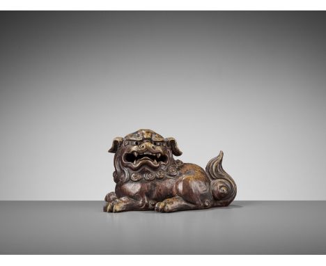 A BIZEN STONEWARE MODEL OF A SNARLING SHISHIJapan, 19th century, Edo period (1615-1868)The shishi in a recumbent posture, wit