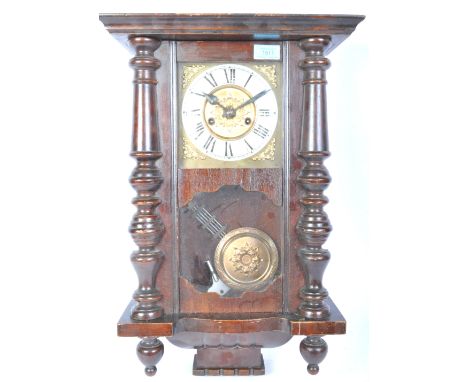 An early 20th century mahogany cased wall hanging clock. The clock having a silvered dial with roman numeral to the chapter r