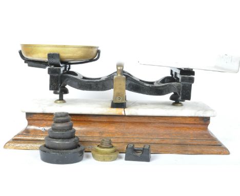 A retro vintage 20th century ebonised brass &amp; metal parcel scale. the lot coming with various weights. The scale resting 