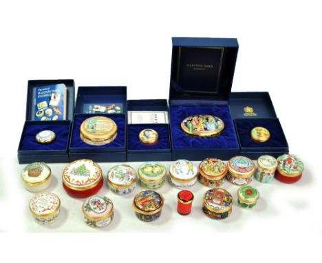 A small collection of Halcyon Days enamel trinket and pill boxes to include Christmas boxes, a boxed music box decorated with