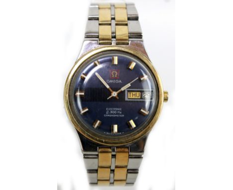 OMEGA; a gentleman's bi-metallic electronic chronometer, F300HZ, with day date apertures, diameter excluding winding crown 3.