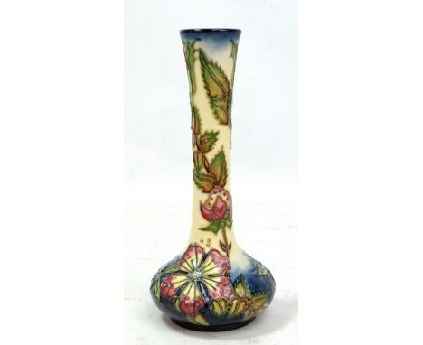 MOORCROFT; a floral tubeline decorated bottle vase, impressed marks and year cipher for 1999, height 20.5cm.Additional Inform
