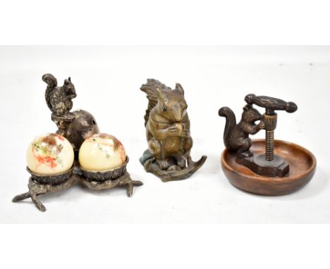 A Victorian lidded brass inkwell modelled as a squirrel with a nut, height 10cm, a nutcracker, a Victorian squirrel cruet set