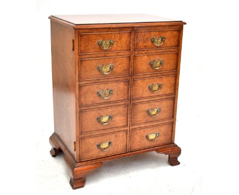 A walnut hi-fi cabinet with hinged top on bracket feet, 81.5 x 60.5cm.