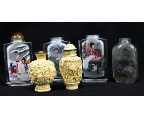 A 20th century Chinese reverse painted glass snuff bottle, decorated with scenes of children playing in the snow, height 8.5c