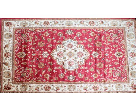 A red ground Keshan carpet, 280 x 200cm.