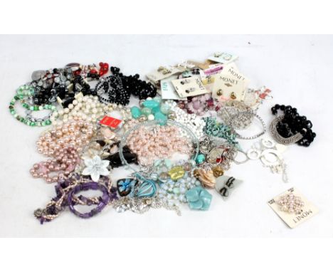 A collection of costume jewellery including numerous Monet ear clips, silver chains with mounted pendants, bead necklaces, tw