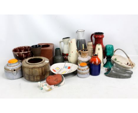 A small collection of predominantly German ceramic vases, also an Austrian Adolf Prischl wall mask and a green Rummer type gl