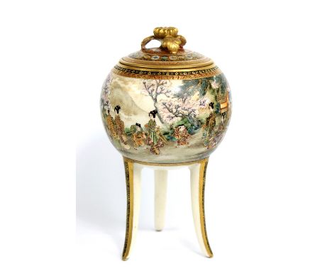 RYOZAN; a Japanese Satsuma globular tripod box and cover, the main body decorated with a near continuous band of figures in a