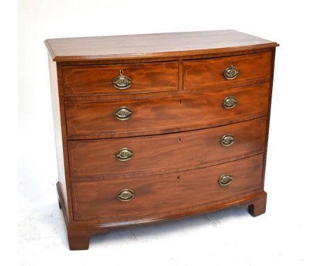A late George III mahogany and inlaid bowfronted chest of two short over three long drawers on bracket feet, 95 x 110cm.Addit