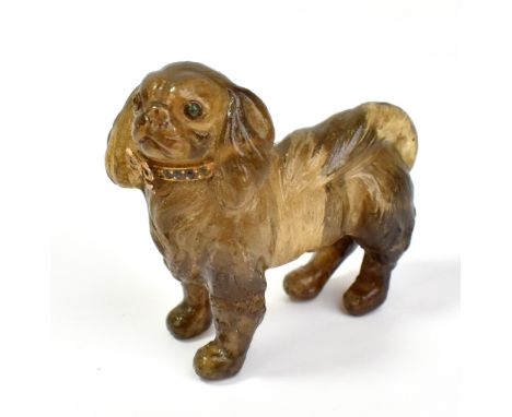 ATTRIBUTED TO FABERGÉ; a well carved rock crystal model of a King Charles Spaniel with gem set eyes and yellow metal collar, 