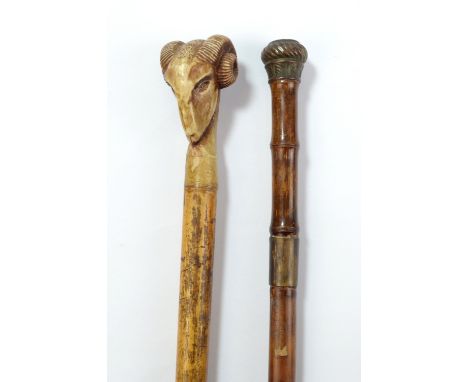 A bamboo sword stick with copper handle, length 91cm, and a cane with ram's head handle.Additional InformationWear and tear t