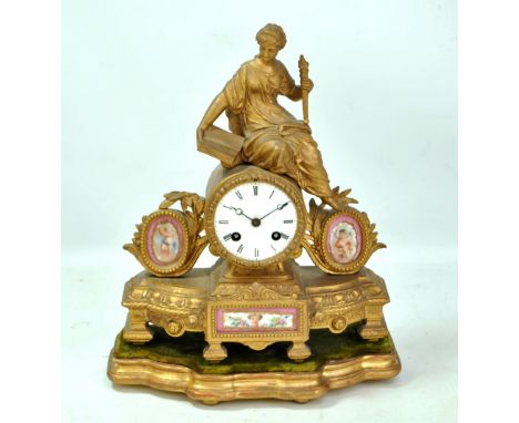 A late 19th century French gilt metal eight day mantel clock surmounted by female personification of Liberty holding torch an